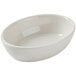 A Tuxton eggshell oval bowl on a white background.