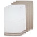 A group of tan and white Monarch Brands terry kitchen towels with a diamond pattern border.