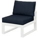 A white POLYWOOD modular armless chair with a marine indigo cushion.