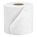 A Cottonelle Professional individually-wrapped toilet paper roll on a white surface.