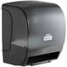 A Lavex Select black paper towel dispenser with a motion sensor.