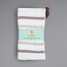 A white dishcloth with brown stripes.