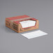 A box of WypAll white heavy-duty foodservice wipers with a white paper on top.