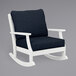 A white POLYWOOD rocking chair with a blue cushion.