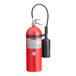 A red Buckeye fire extinguisher with a black hose and handle.