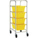 A Regency mobile aluminum lug rack with yellow meat lugs on it.