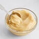 A spoonful of American Almond Macaroon Paste in a bowl.