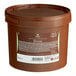 A brown bucket of Cacao Barry Brune Pate a Glacer compound coating with a white label.