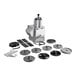 A Robot Coupe CL50 Ultra commercial food processor with various stainless steel parts and screws on a counter.