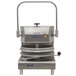 A DoughXpress stainless steel pizza dough press with a handle.