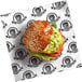 A burger on a white EcoChoice deli wrapper.