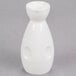 A close-up of a white porcelain Fuji Sake bottle with a handle.