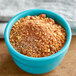 A blue bowl with a pile of Regal Smoke Pit Maple Seasoning.