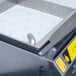 A VITO fryer oil filter machine with a tray of paper towels on top.