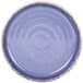 A close-up of an indigo blue Monet melamine plate with a raised rim.