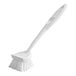 A white Quickie dish brush with a handle and polypropylene bristles.