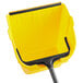 a yellow scoop with black handle