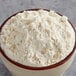 A bowl of White Lily Enriched Bread Flour on a table.