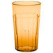 A close up of an amber Cambro plastic tumbler.