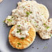 a plate of biscuits with gravy and herbs