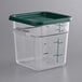 A clear square Vigor polycarbonate food storage container with a green lid.