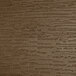 A close-up of a weathered acorn faux wood surface.