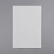 A white piece of paper on a gray surface.