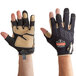 A pair of tan and black Ergodyne ProFlex heavy-duty leather-reinforced gloves being worn.