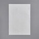 A white paper on a gray surface.