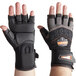 A pair of black and orange Ergodyne ProFlex heavy duty work gloves with wrist support.