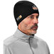 A man wearing a black Ergodyne flame-resistant knit beanie.