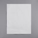 A white paper filter on a gray surface.