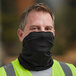 A man wearing a black Ergodyne Chill-Its face covering over his face.