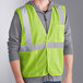 A man wearing an Ergodyne lime green reflective safety vest.