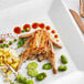 a cooked chicken with vegetables on a plate