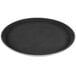 A black round Carlisle GripLite non-skid serving tray.