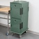 A granite green Cambro Ultra Camcart food pan carrier on wheels.