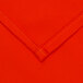 An orange hemmed fabric with white lining.
