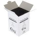 A white box with black straws inside.