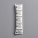 A white Multisorb NatraSorb desiccant packet with black text.