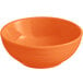 An Acopa Capri Valencia orange stoneware bowl.