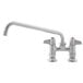 A silver Equip by T&amp;S deck-mounted faucet with lever handles and a blue knob.