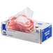A white box with a red and white plastic bag with a crab on it.