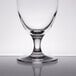 A Stolzle Nadine wine goblet on a reflective surface.