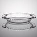 An Anchor Hocking clear glass pie pan with a clear rim.