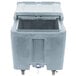 A Cambro slate blue plastic mobile ice bin with a sliding lid.