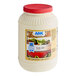 A white plastic AAK salad dressing container with a red lid and label.
