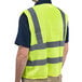 A man wearing a Cordova lime high visibility safety vest.