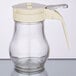 A Tablecraft glass syrup dispenser with a handle and an ABS lid.