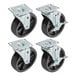 A set of 4 black casters with steel wheels and metal plates.
